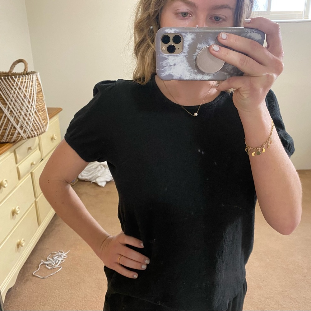 This is a Black, short-sleeved, Madewell shirt. Size M.
